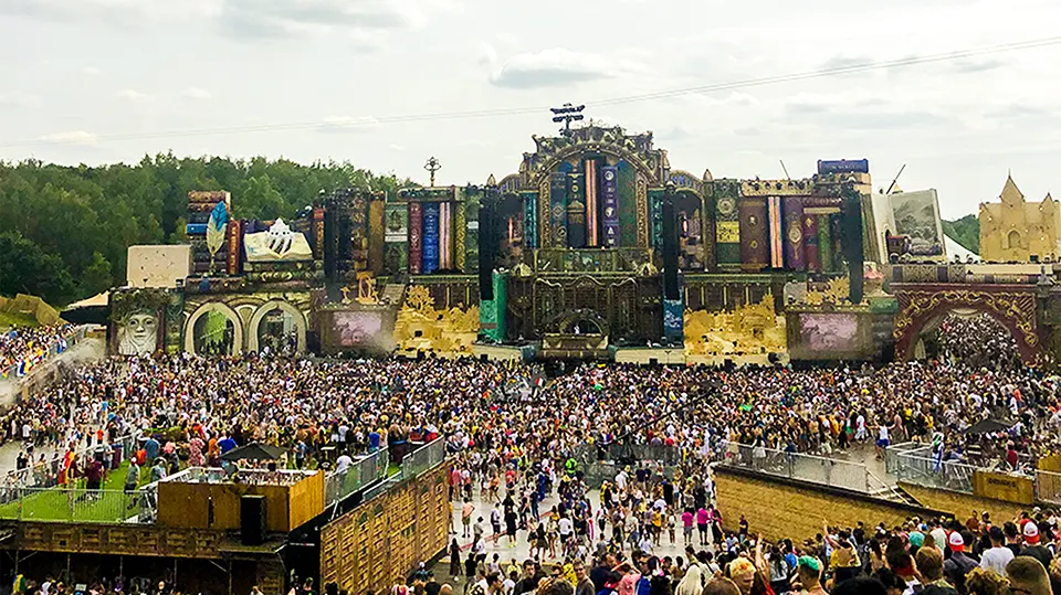 Tomorrowland iconic mainstage design with spectacular lighting and pyrotechnics at night